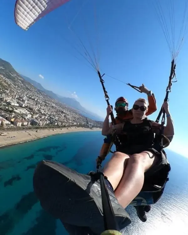 Tandem paragliding from Side