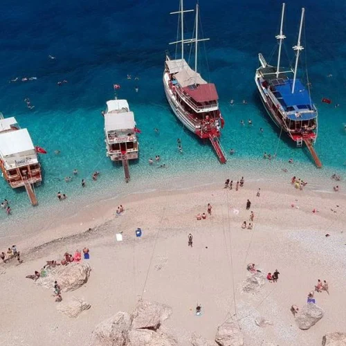 Boat cruising along the Mediterranean coast near Kemer