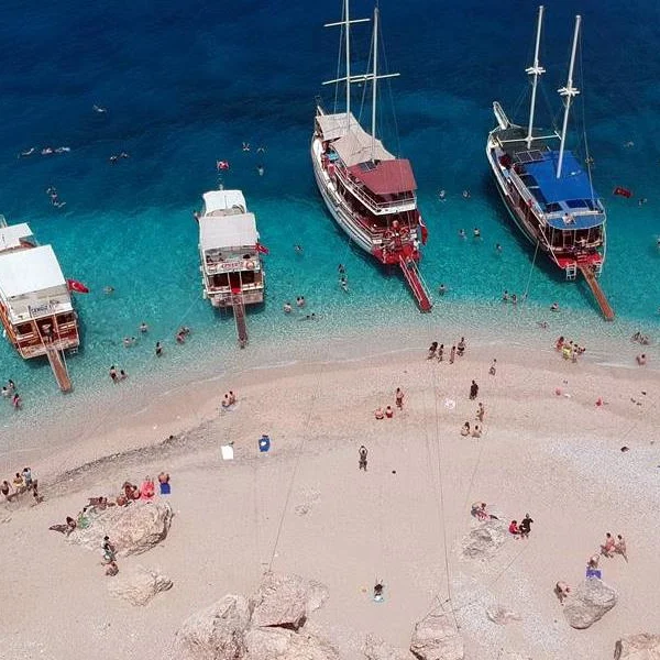 Boat cruising along the Mediterranean coast near Kemer