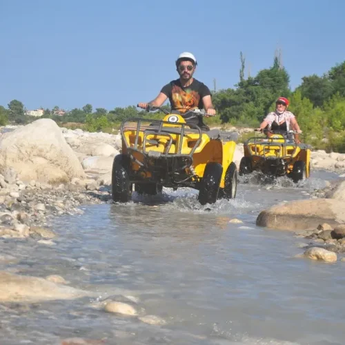 Riders exploring rugged terrain on a Kemer ATV tour